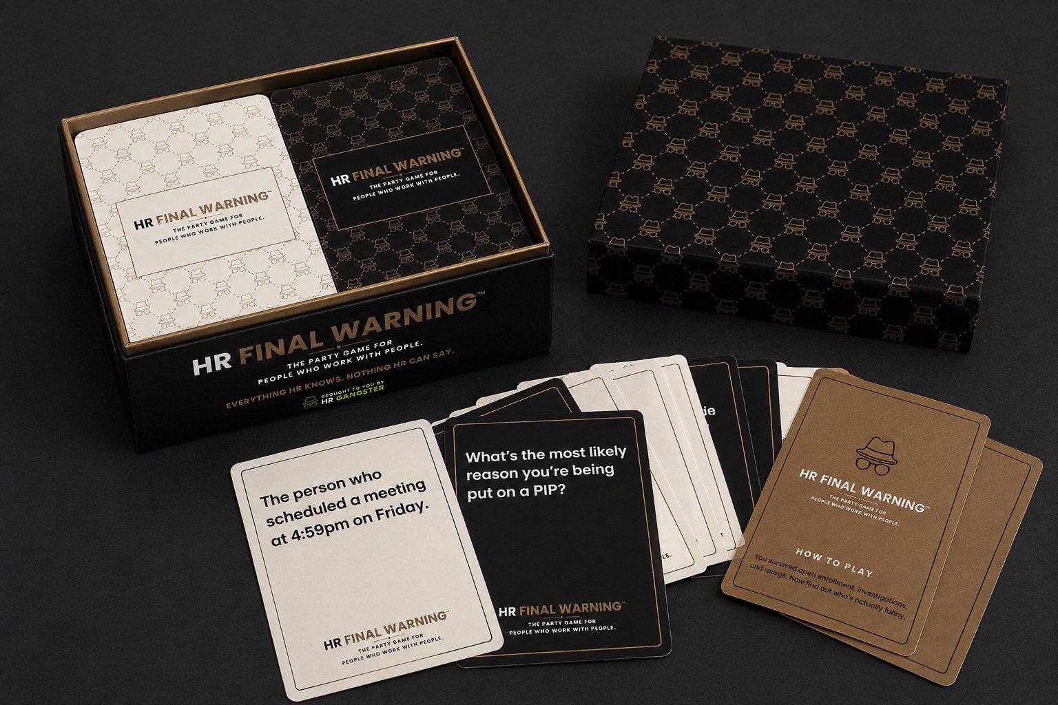 A spread of real HR Final Warning cards next to the box, including the black prompt card "The CEO accidentally created three HR problems by saying ________."